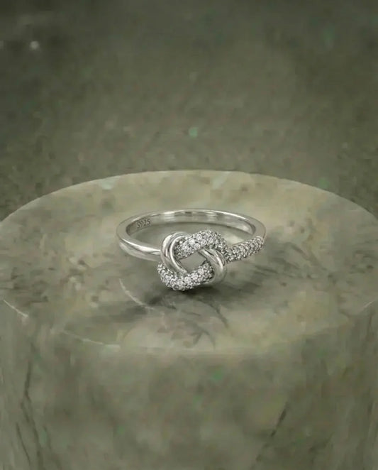 Simulated diamond ring heart knot