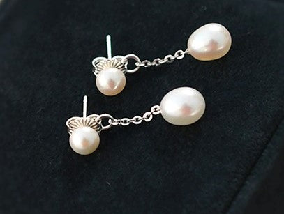 Orecchini con doppia perla bianca