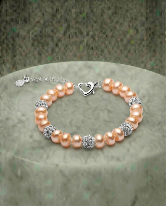 Ferskenperle og zirkonarmbånd