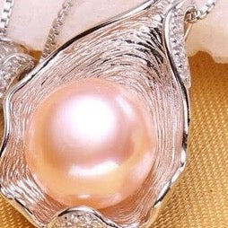 Collar de perlas rosas reales con concha