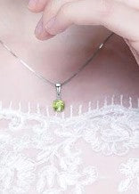 Real Peridot Pendant with simulated Diamonds